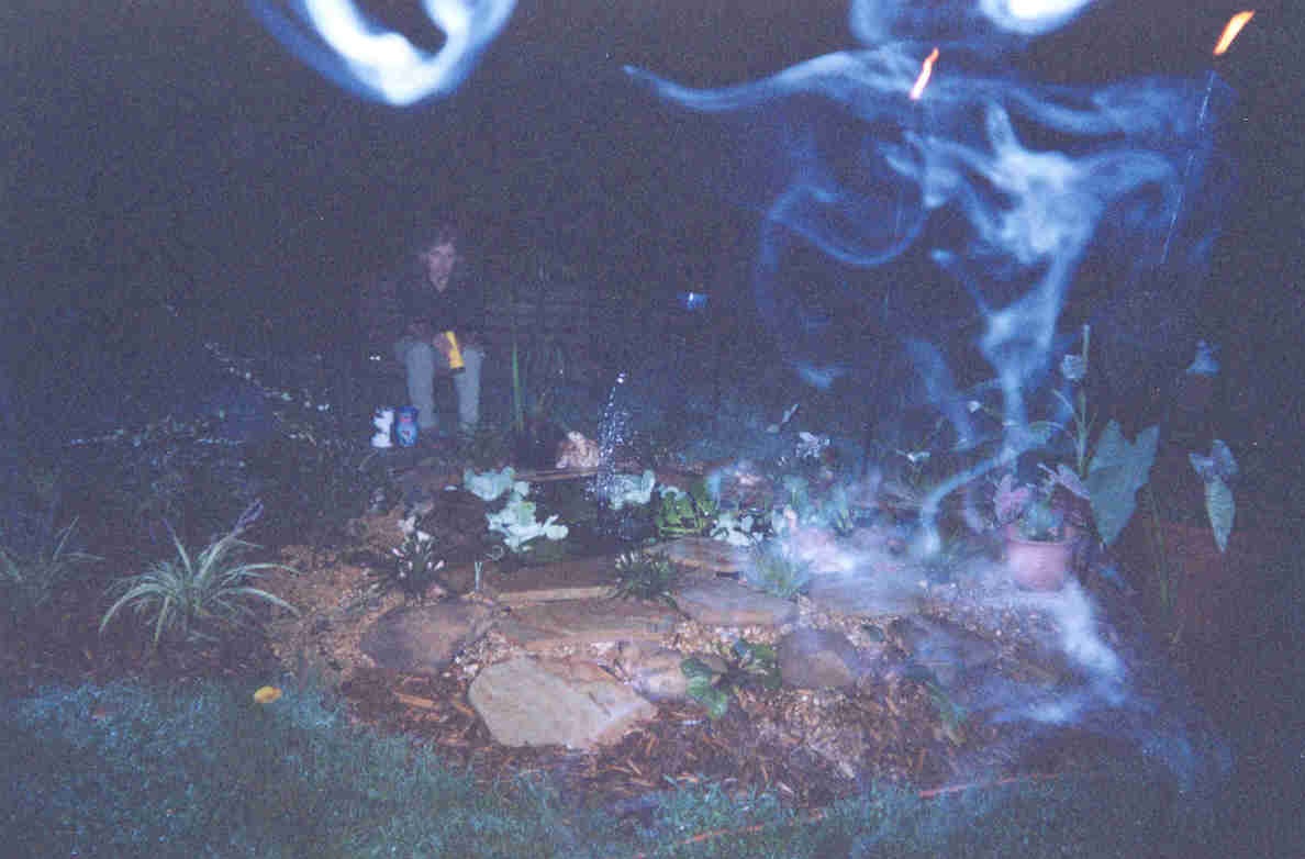 Photo of Cody relaxing by his pond.